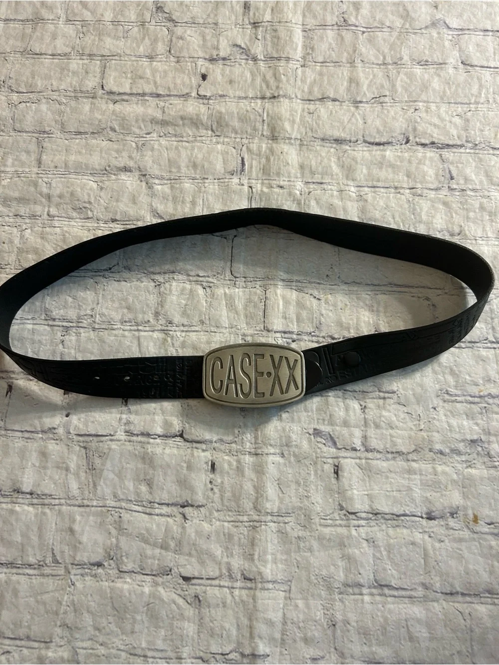 ARMANI EXCHANGE BLACK LEATHER LOGO EMBOSSED BELT CASE.XX FINE PEWTER BUCKLE